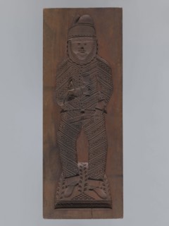 Double-sided gingerbread form. Obverse: male figure with a chalice in hand; reverse: baby in