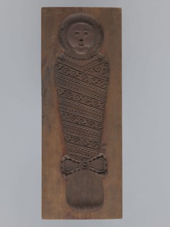 Double-sided gingerbread form. Obverse: male figure with a chalice in hand. Reverse: baby in