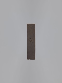 Double-sided gingerbread form. Obverse: male figure with a chalice in hand; reverse: baby in