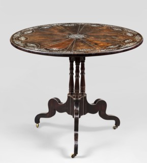 Table with round, tilting top on a shaft composed in the middle of three balusters, forked at the