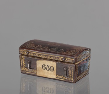Case for a stamp, bookbinding, embossing; leather case in the form of a chest slightly widened at