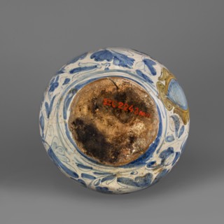 Bottle. Spherical bottle, narrowed at the top with a pressed rim, the foot slightly widening at the