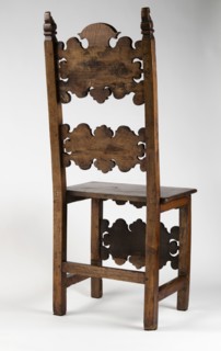 Chair, carved, reclaimed, volutes ornament, Renaissance style. CHAIR with a board seat and a high