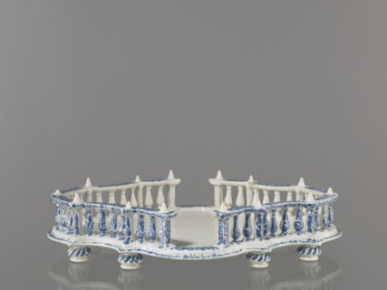 Base for a tabletop tray. Oval architectural tray serving as a base for a tabletop tray. Carved