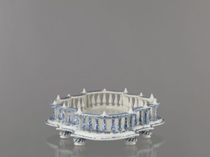 Base for a tabletop tray. Oval architectural tray base carved with 4 leaves and a wavy edge