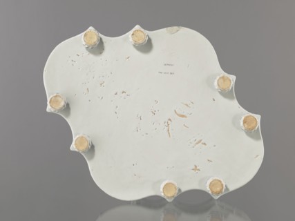 Base for a tabletop tray. Oval architectural tray serving as a base for a tabletop tray. Carved