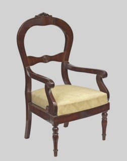 Armchair, veneered with mahogany, with a trapezoidal upholstered seat removable cushion and a