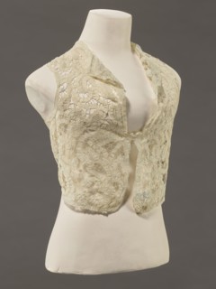 Bodice, lace; bodices, women's clothing, fashion. In a pattern of rosettes connected by large
