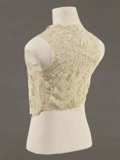 Bodice, lace; bodices; women's clothing; fashion. Pattern of rosettes connected by large spiders