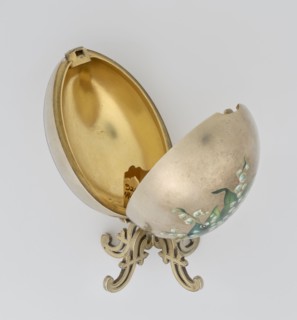 Easter egg, lilies of the valley and flowers motif; silver egg, smooth, composed of two opening