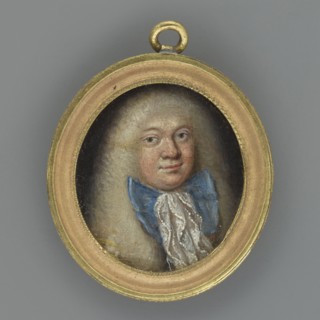 Portrait of a man in a light wig and jabot with a large blue bow; unknown author; costume: frock