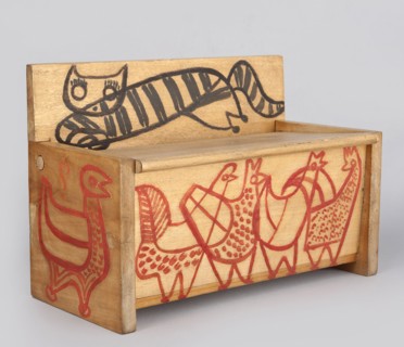 Wooden bench from a set of doll furniture. Wooden bench with a box closed by a flap forming the