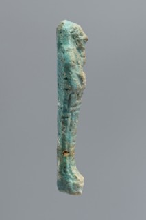 Ushabti, mummy-shaped funerary figurine wrapped in a shroud with its arms crossed on its chest,