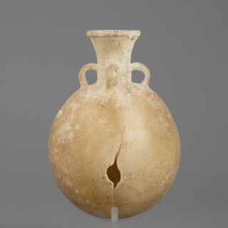 Flask-shaped vessel, stone, pilgrim flask with a spherical flattened belly, narrow widening high