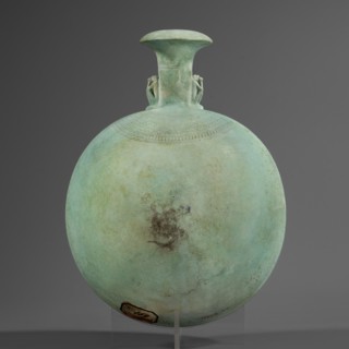 New Year's canteen, Flat round faience canteen with a narrow short neck ending in a chipped spout