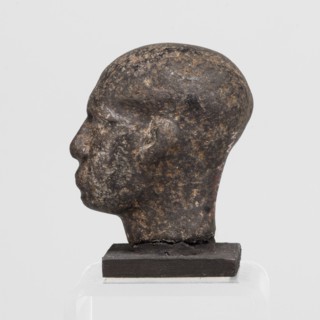 Head of a priest figurine, male, Egyptian sculpture; a man's head fragment of a statuette,