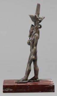 Figurine of the god Nefertum;, Egyptian deity Nefertum; Egyptian religion; Egyptian art; crowns;
