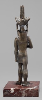 Figurine of the god Nefertum; Egyptian deity; sculpture in Egyptian art; material/creator, crowns;