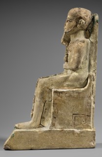 Figurine of the god Ptah. Figurine of the god Ptah sitting on a throne, on a base in the shape of