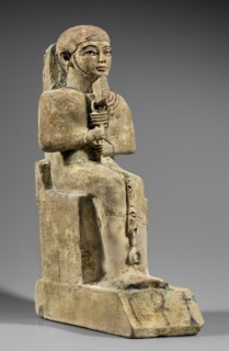 Figurine of the god Ptah. Figurine of the god Ptah sitting on a throne, on a base in the shape of