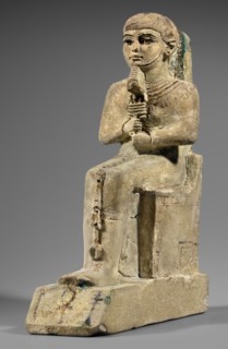 Figurine of the god Ptah. Figurine of the god Ptah sitting on a throne, on a base in the shape of