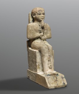 Figurine of the god Ptah. Figurine of the god Ptah sitting on a throne, on a base in the shape of