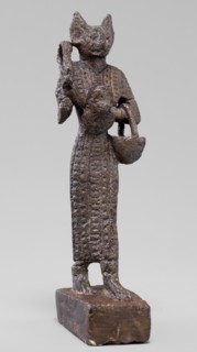 Figurine of the goddess Bastet. Figurine of a goddess with a cat's head, dressed in a
