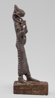 Figurine of the goddess Bastet. Figurine of a goddess with a cat's head, dressed in a