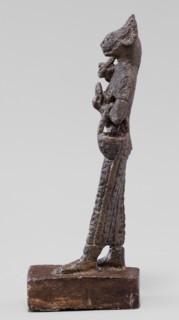 Figurine of the goddess Bastet. Figurine of a goddess with a cat's head, dressed in a
