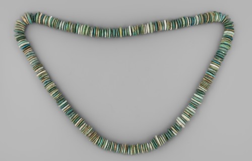 Necklace of disc-shaped beads. Long necklace consisting of flat, disc-shaped beads thicker in the