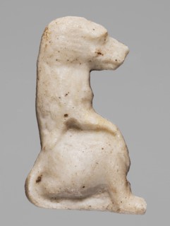 Amulet — sitting baboon; white glass; Ptolemaic Period, 332–30 BC, Egypt; height 2.2 cm, width 1.7