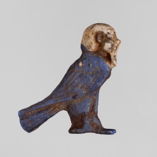 Amulet - Ba, Ba myth., Egyptian religion, grave goods, white human head on navy blue bird