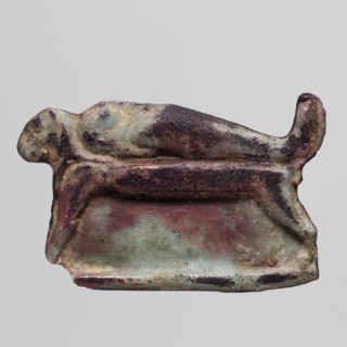 Amulet - mummy lying on a lion bed; mummification bed iconography, mummies, lions; amulet, height 2