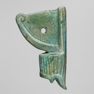 Amulet - red crown, red crown made of green-glazed faience with a hole in the field between the