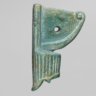 Amulet — red crown made of green-glazed faience with a hole in the field between the protruding