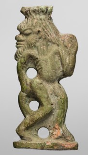 Amulet — the dancing god Bes; creator, Bes myth., Egyptian deity depicted with feathers, dancing