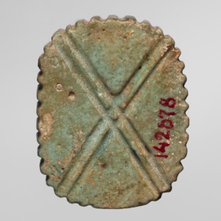 Amulet — plaque with the head of the god Bes; maker, found in Goluchów Greater Poland Voivodeship;