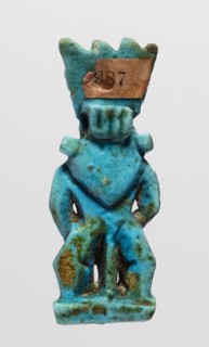 Amulet - god Bes, Bes myth., Figurine of Bes standing on slightly crooked legs, with his hands
