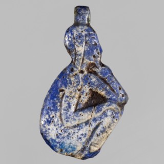 Amulet - god Horus-child; maker, figure with tucked legs and a finger to the mouth; Horus myth.,