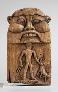 Magical stele topped with the mask of the god Bes. Magical stele cippus depicting in the lower