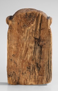 Magical stele topped with the mask of the god Bes. Magical stele cippus depicting in the lower