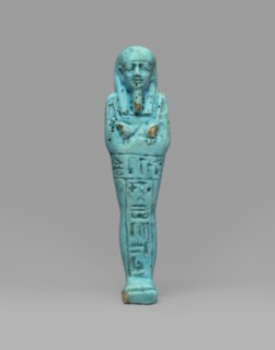 Ushabti Wahibre-em-achet. Mummy-shaped funerary figurine shabti made of blue faience with black