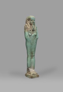 Ushabti Psamtyk-seneb, Mummy-shaped funerary figurine shabti, standing on a base, back supported by