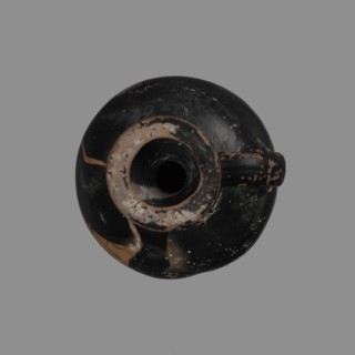 Aryballus lekythos with a ring-shaped foot, a bulging belly, and a high neck widening towards the