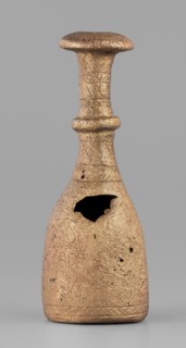 Bottle-type idol base, unknown Luristan workshop. A bottle-shaped base with a long, narrow neck