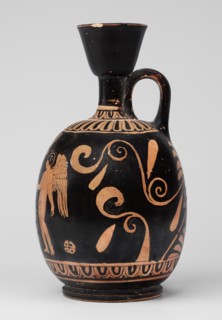 Red-figure aryballus lekythos with a scene of Aphrodite's toilet, On the belly: Aphrodite crouching