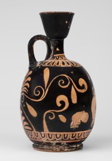 Red-figure aryballus lekythos with a scene of Aphrodite's toilet, On the belly: Aphrodite crouching