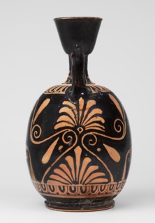 Red-figure aryballus lekythos with a scene of Aphrodite's toilet, On the belly: Aphrodite crouching