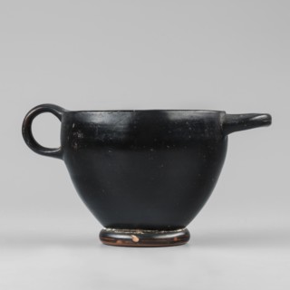 Black-finished skyphos, Type B. Thin-walled skyphos with a deep bowl and annular foot. One handle