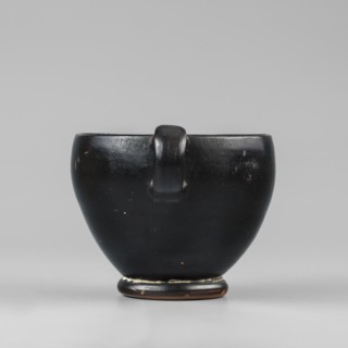 Black-finished skyphos, Type B. Thin-walled skyphos with a deep bowl and annular foot. One handle